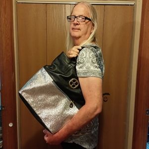 Black and silver purse. Iman brand. Brand New.